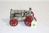cast iron toy tractor with driver