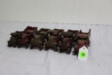 (6) cast iron toy stake body trucks