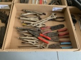 assortment of  vise grips and wire strippers