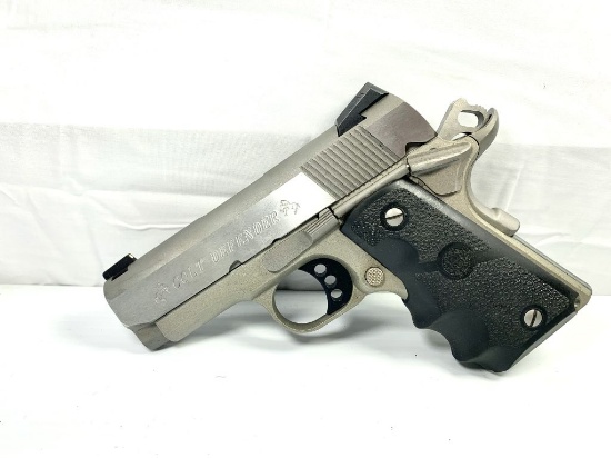 Colt Defender .45 cal gun with Hogue wraparound rubber grip with finger grooves