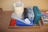 assortment of cases, tubs, and measuring cups
