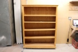 Oak 5 shelf book case on casters