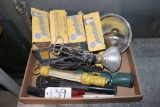 assortment of flashlights and light bulbs