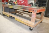 large wood work table on casters