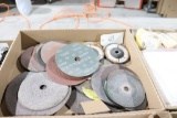assortment of sanding pads and grinding wheels