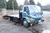 1999 Isuzu NPRroll off truck