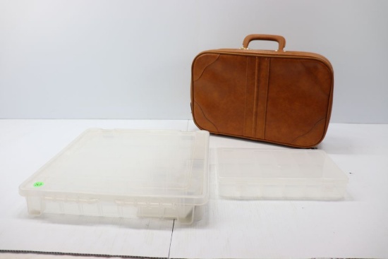 Plastic organizers and leather zip-up briefcase