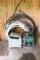 Assortment of Tubing and Garden Hoses in Holders