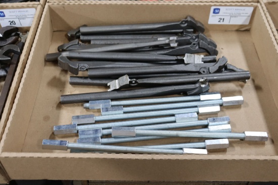 Assortment of pipe wrenches and rod extensions