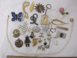 Lot of Women's Costume Jewelry including pin/brooches, earrings, necklaces, and more, 1 lb