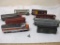 Lot of HO Scale Train Cars including hoppers, boxcars, and engines from Santa Fe, Erie Lackawanna,