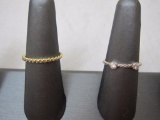 (2) Sterling Size 7 Rings; one silver w/ two cz diamonds & the other a gold-tone spiral rope design,