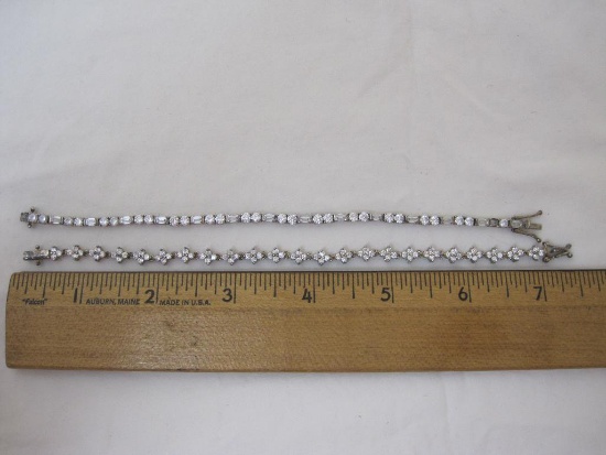 Two Sterling Silver 7" Tennis Bracelets with CZ Stones, one bracelet is missing a stone, 16.3 g