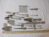 Lot of Silverplate and Weighted Sterling Serving Utensils including pie servers, spoons, forks, and
