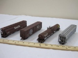 Four HO Scale Santa Fe Train Cars including Tankers, Boxcar (missing 1 coupler), and ATSF Hopper