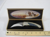 7 3/4 inch knife with Native American theme, in original box, 11 oz