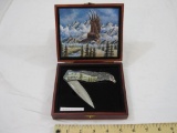 7 inch Cast Bald Eagle Pocket Knife, stainless steel blade, inset scene on handle, in original box,