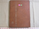 Book of assorted US stamps, foreign stamps and first day of issue envelopes