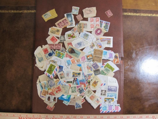 Lot of assorted US and Foreign postage stamps, some on envelopes