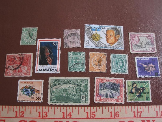 Lot of canceled Jamaica postage stamps, including one commemorating the 50th anniversary of Bob