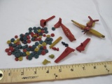Lot of Vintage Waxy Plastic Planes and Parts including wheels, bulldozer scoop, and more, 5 oz