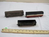 Three HO Scale Train Cars including Erie Lackawanna Hopper and Boxcar and Red White and Blue Boxcar,
