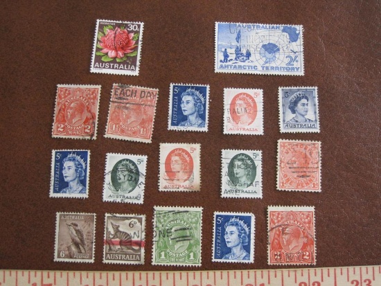 Lot of approximately a dozen cancelled Australian postage stamps,