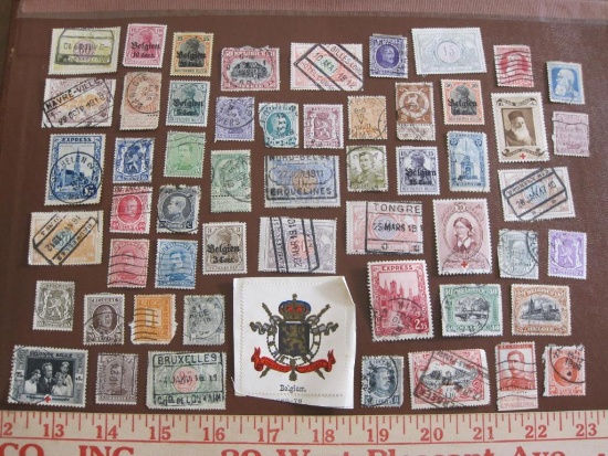 Lot of approximately four dozen cancelled Belgian postage stamps