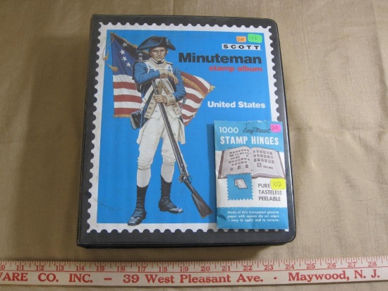 Scott Minuteman US Stamp album with opened package of stamp hinges. Album is partially full, not all