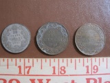 Three Canadian coins: 1918 one cent; 1920 one cent; and 1931 25 cents. 0.6 oz