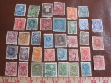 Lot of approximately three dozen Austrian postage stamps, some used, some cancelled, some with hinge