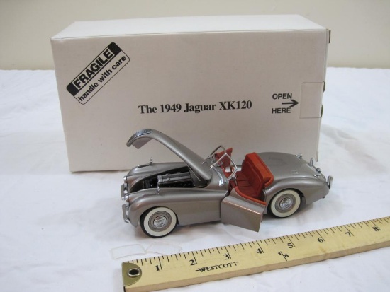 The 1949 Jaguar XK120 Diecast Model Car, The Danbury Mint, in original box, damage to windshield, AS