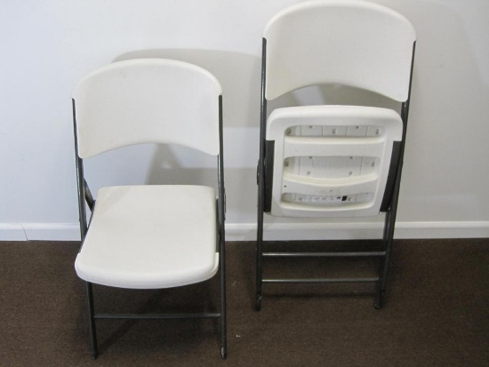 Two heavy duty plastic Lifetime folding chairs