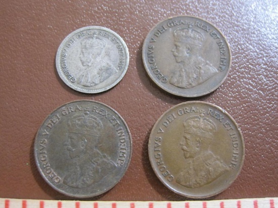 Lot includes one 1913 Canada silver dime and three Canada one cent coins, 1921, 1934 and 1936