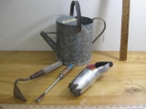 Gardening items including vintage metal watering can, miniature hoe, hand weeder and 3 inch hole