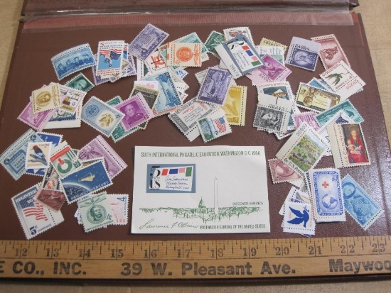 "Giant Grabbag of 100 Mint U.S. Stamps" includes one hundred mint US postage stamps of various ages