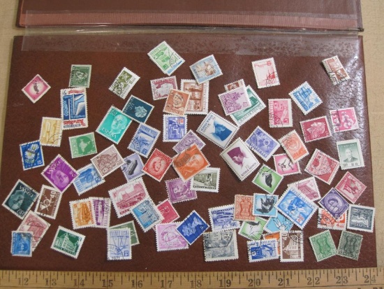 Lot of 60+ assorted cancelled foreign postage stamps from various countries inlcuding Spain,