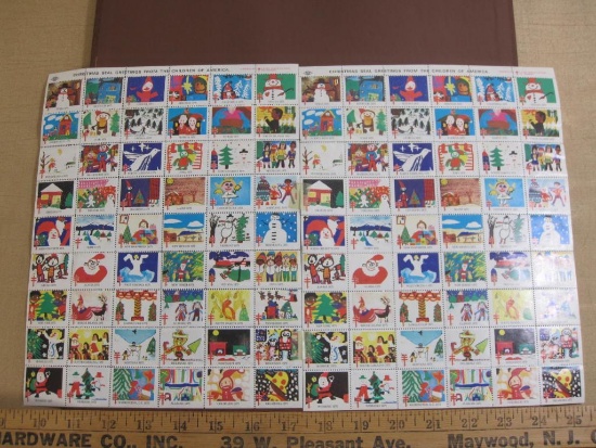 TWO full sheets of 54 1975 American Lung Association US Christmas seals; sheets are hinged together,