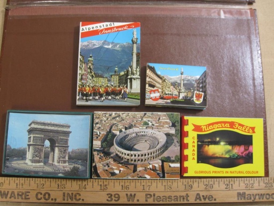 Four small souvenir photo booklets (Niagara Falls, Innsbruck, Austria and Roman sites in France) as