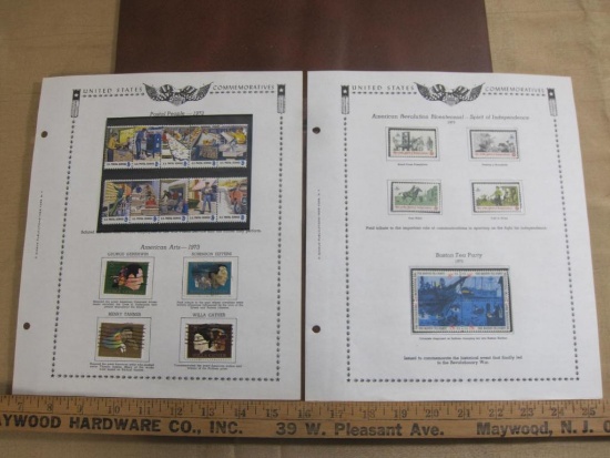 Two completed stamp collecting album pages printed by Minkus Publications; includes eighteen mounted