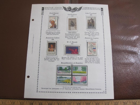 Completed stamp collecting album page printed by Minkus Publications; includes nine mounted mint
