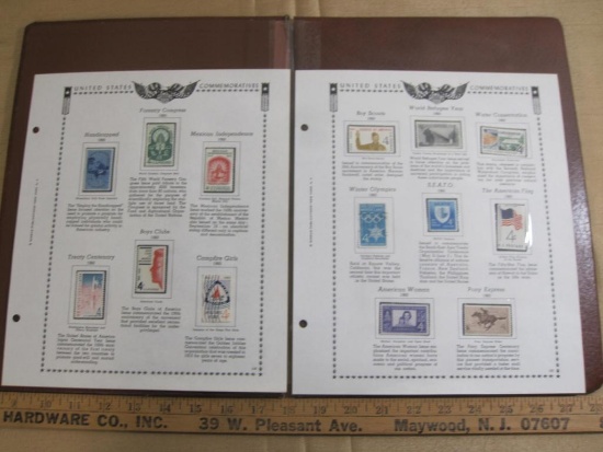 Two completed stamp collecting album pages printed by Minkus Publications; includes twelve mounted