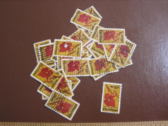 Lot of more than one dozen cancelled 1974 10 cent Christmas Angel US postage stamps, Scott # 1550