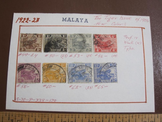 Eight hinged canceled 1922-23 Malaya stamps. They are "The Tiger Issue of 1906, New Colors"