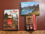 Three small postcard books: one 