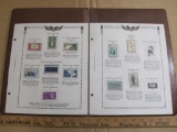 Two stamp collecting album pages printed by Minkus Publications; includes ten mounted mint stamps