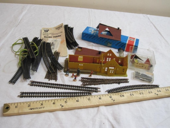 Lot of N Scale Train Pieces including track, building, hardware, and more, 2 lbs 4 oz