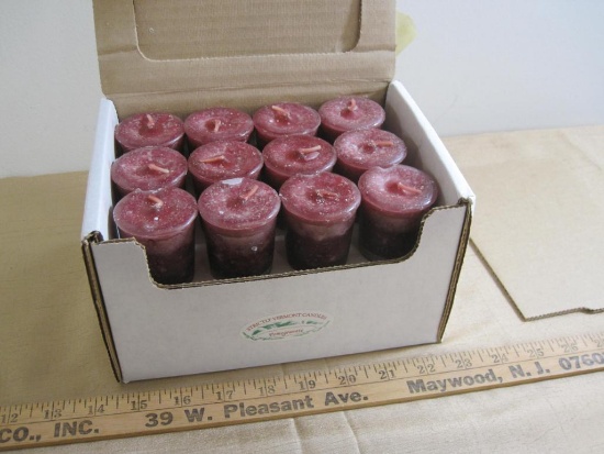 Box full of small pomegranate scented Strictly Vermont candles