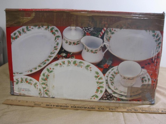 Sealed box of 45 piece Christmas dish set, includes 8 cups, 8 saucers, 8 soup bowls, 8 salad plates,