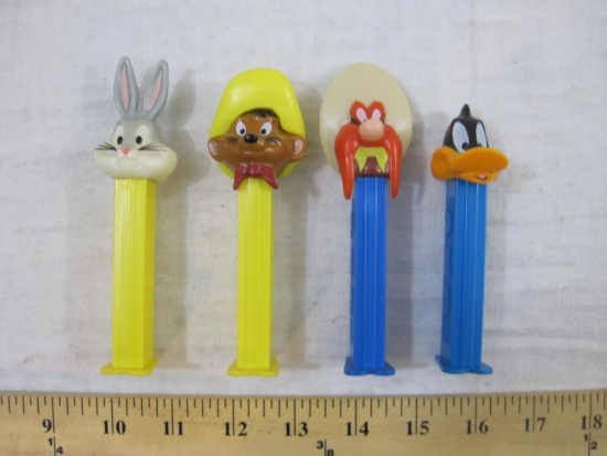 Four Vintage Looney Tunes PEZ Dispensers including Bugs Bunny (Hungary), Daffy Duck (Hungary),